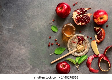 Jewish New Year - Rosh Hashanah. Apples, Pomegranate And Honey On A Dark Rustic Background. Traditional Jewish Food. Top View, Flat Lay,space For Your Text