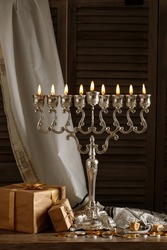 Jewish Religious Holiday Hanukkah With Holiday Hanukkah (traditional Candelabra), Tallit, Gift Boxes, Wooden Dreidels (spinning Top), Chocolate Coins On Wood Background