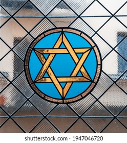 Jewish six pointed star. Magen Dawid. Stained glass with jewish symbols