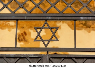 Jewish Star of David on the metal gate. Symbol of the Jews.