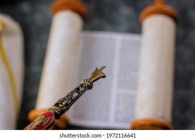 Jewish synagogue Judaic religion of Torah Scrolls with the pointer for reading the Torah a bar mitzvah ceremony
