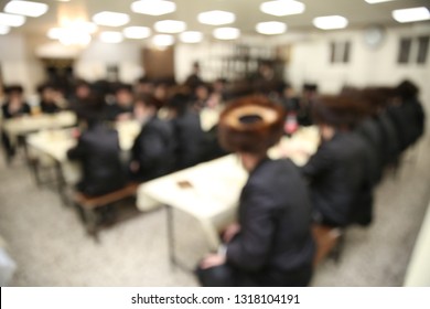 Jewish Ultra Orthodox Hasidic Men Sit And Learn Torah In A Yeshiva Study Hall