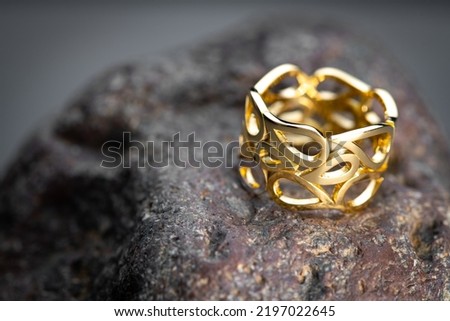 Jewlery Golden Ring on Natural Stone