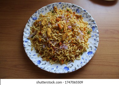 JhalMuri, A preparation of puffed rice with potatoes,onions,green chilies, peanuts,boiled chickpeas and spices. It is a common street food of Eastern India.