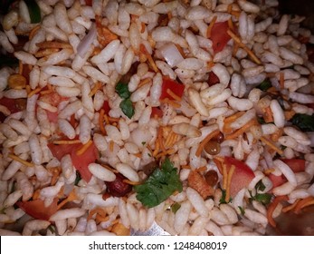 Jhalmuri is a street snack originating from the Bengal region of the Indian subcontinent, made of puffed rice and an assortment of spices, vegetables, and chanachur or bhujia.