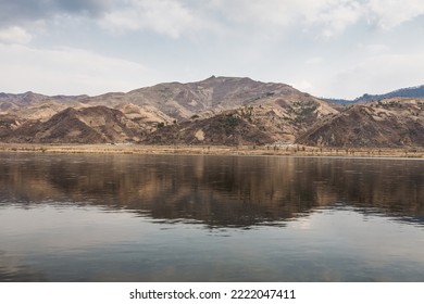 JI'AN, JILIN PROVINCE, CHINA: Yalu river, sino-korean border, view of countryside and small farming village accross the river, in North Korea - Shutterstock ID 2222047411