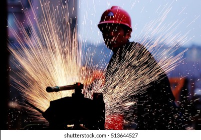 JIANGXI CHINA-March 22, 2013:  Migrant Workers Are A Real Estate Developer Of New Commercial Housing Development.Welding Iron And Steel Production