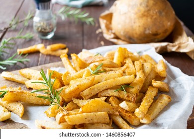 Jicama Fries, Mexican food with rosemary, olive oil, pepper and himalayan salt on wooden table