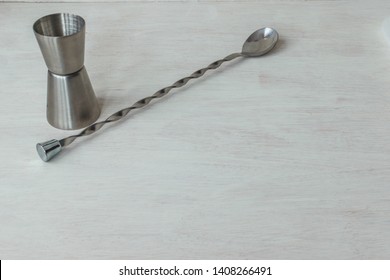 Jigger And Mixing Spoon In A White Background With Space For Copytext. Barista Cocktail Kit