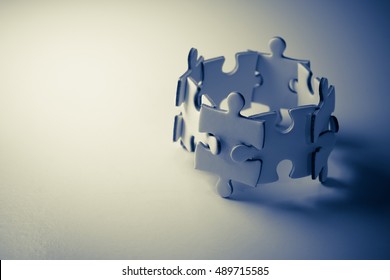 Jigsaw puzzle concept teamwork. Team building help and support concept. - Shutterstock ID 489715585