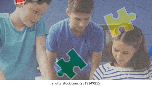 Jigsaw puzzle and human head icon against diverse group of students using digital tablet at school. Autism and school education concept - Powered by Shutterstock