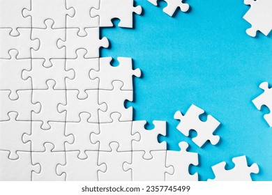 Jigsaw Puzzle on Blue with abstract background - Powered by Shutterstock