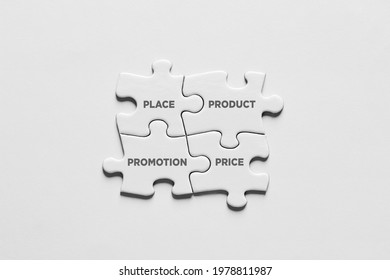 Jigsaw puzzle pieces connect to each other and form the 4P of marketing mix. Product, place, promotion and price in business marketing strategy.