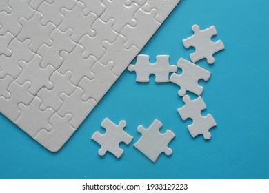 Jigsaw Puzzle Pieces On Blue Background