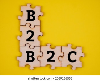 Jigsaw puzzle with text "B2B and B2C" isolated with yellow background. Business concept. - Shutterstock ID 2069156558