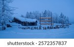 Jilin Yalong Bay winter landscape with snow-covered cottage and drying fruit under winter sky