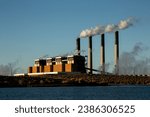 Jim Bridger Power Plant at Sunset with Steam coming from smokestacks at Point of Rocks Wyoming