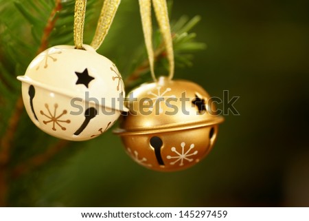 Jingle bells on Christmas tree with copy space. Selective focus, shallow DOF.