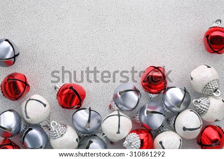 Jingle bells on silver background