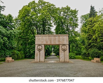 Târgu Jiu, RO - May 17, 2021: Gate of the Kiss (Poarta Sărutului) and Alley of the Chairs (Aleea Scaunelor) by Constantin Brancusi sculptural ensemble. UNESCO world heritage monument site in spring.
