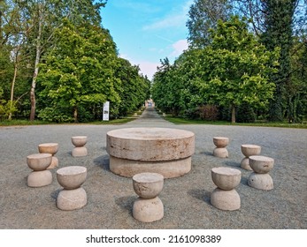 Târgu Jiu, Romania - May 4, 2022: Table of Silence, Alley of Chairs and Gate of the Kiss monuments by Romanian sculptor Constantin Brancusi. Sculptural ensemble situated in the city central park.