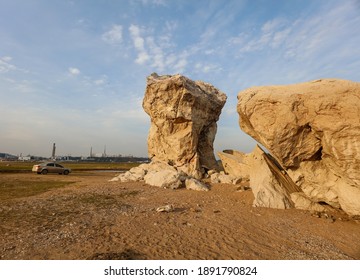 JIUJIANG, CHINA - January 10, 2021: The toad rock that sank at the bottom of Poyang Lake, China's largest freshwater lake, becomes a spectacle as the water level continues to be low. The toad stone is