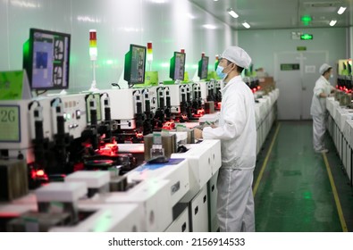 Jiujiang, China - May 14, 2022: Workers Operate Intelligent Machines To Produce LED Product Orders At The Production Workshop Of Jiangxi Lanke Semiconductor Co., LTD In The Emerging Industry Base.
