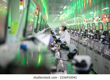 Jiujiang, China - May 14, 2022: Workers Operate Intelligent Machines To Produce LED Product Orders At The Production Workshop Of Jiangxi Lanke Semiconductor Co., LTD In The Emerging Industry Base.
