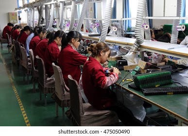  Jiujiang, China-MAY 13, 2014:A High - Tech Manufacturing Enterprise For Producing Electronic Chip. Workers Are Putting Electronic Components Into Circuit Boards.