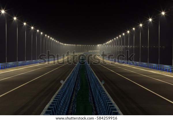 JIUJIANG CHINA-October 28, 2013:the Jiujiang\
Yangtze River Highway Bridge opened to traffic, the bridge\
spectacular night scenery. Ranked seventh in the world. Jiangxi\
province in eastern\
china.