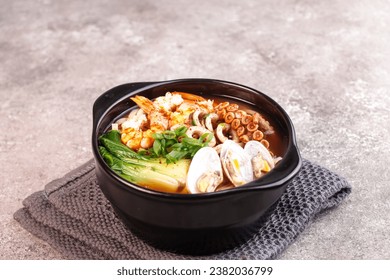 Jjampong is Red Spicy Seafood Korean Noodle Soup with Vegetable, Shrimp, Octopus  and Clam.