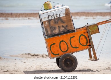 JOAO PESSOA, PARAIBA, BRAZIL - DECEMBER 23, 2021: Coconut cart on the beach written that the seller accepts payments in PIX, a Brazilian form of digital payment.