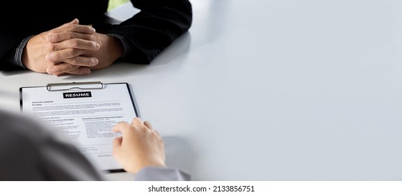 The job applicant is checking the resume with the Human Resources Department before taking the job interview with the department manager who has submitted the application. Job application ideas. - Shutterstock ID 2133856751