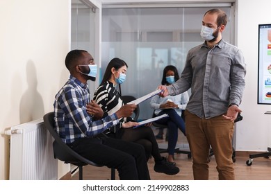 Job Applicant Talking With HR Department Head Manager About Internal Regulations And Required Documentation For Employment. Recruitment Officer Discussing With Candidate Career Oportunity.