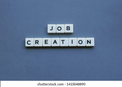 ' Job Creation ' Word Made Of Square Letter Word On Grey Background.