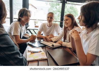 Job with documents in progress, start up. Group of young friends are in the cafe restaurant.