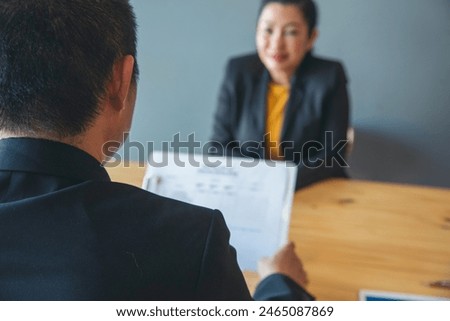 Job HR applicants having an interview with Human resource manager jobs interviewing with confident candidate at business firm office give cv resume. Job Interview with headhunter agent and applicant