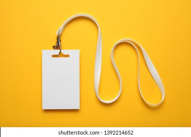 Job identity name tag on yellow background, badge and lanyard. Staff identity card. - Shutterstock ID 1392214652