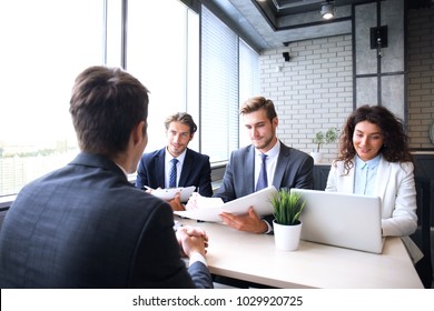 Job interview with the employer, businessman listen to candidate answers.