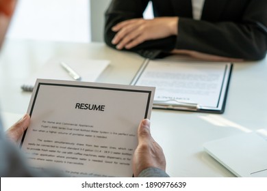 Job Interview In Office, Focus On Resume Writing Tips, Employer Reviewing Good Cv Of Prepared Skilled Applicant, Recruiter Considering Application, Hr Manager Making Hiring Decision