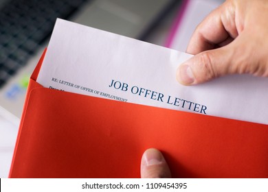 Job Offer Letter In Red Envelope. A Man Get An Offer With Hiring For Working.