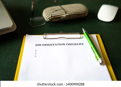 Job Orientation Checklist On An Office Desk, An Onboarding Concept