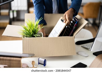 Job Quit. Employee Holding Cardboard Box At Desk