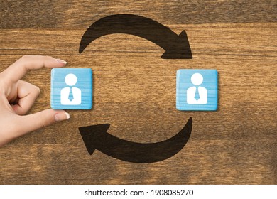 Job rotation or staff turnover icon on wooden blocks