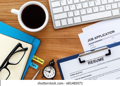 Job search with resume and job application on computer work table background