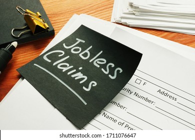 Jobless Claims Memo Stick And Pile Of Documents.