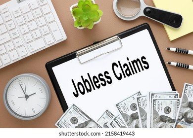 Jobless Claims . Text On Paper On Black Folder With Clip