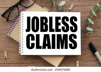 Jobless Claims. Text On White Paper On Wood Table Background