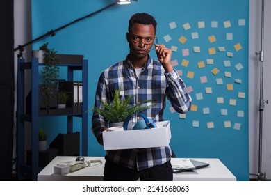 Jobless Company Worker Carrying Belongings And Thinking About Failed Career. Entrepreneur Getting Fired And Packing Office Things To Leave Job, Feeling Upset And Dissapointed About Dismissal.