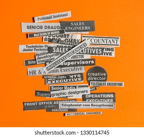 Jobs Or Careers Concept: Multiple Job Titles Or Occupations Cut Off From Newspaper With Immediate Vacancies On Top Of The Pile And On Orange Background